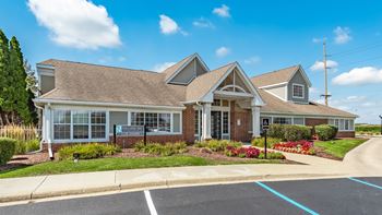 A building with a parking lot in front of it